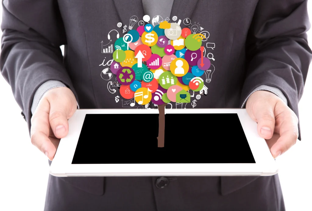 businessman holding tablet with colorful icons